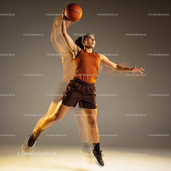 Athletic woman jumping for basketball slam dunk