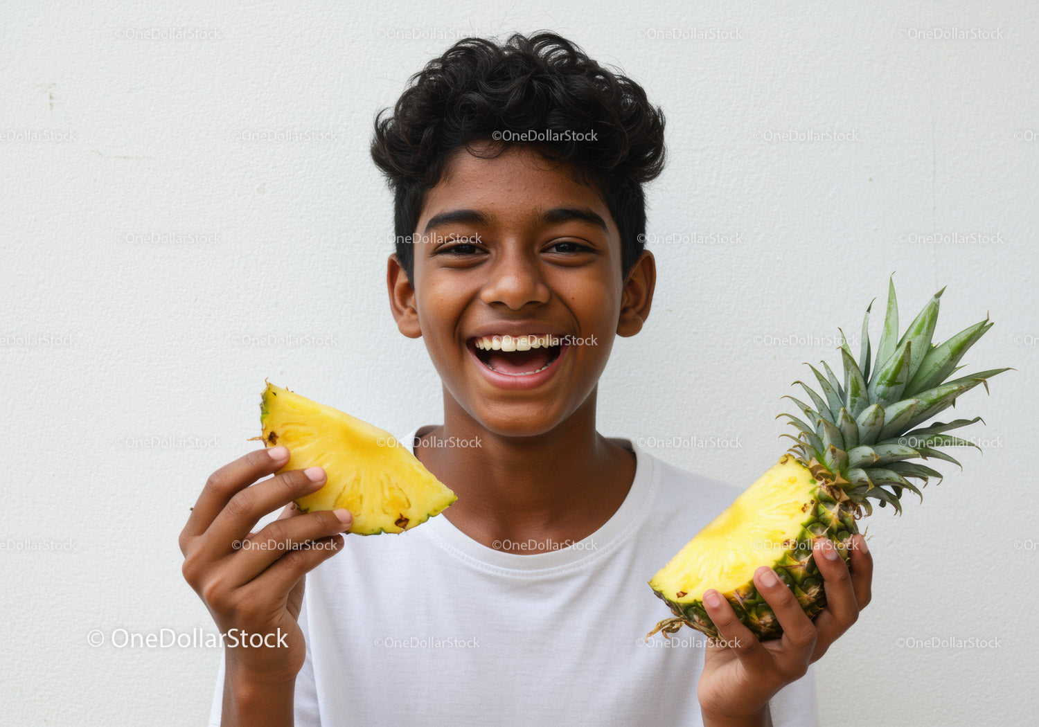 Joyful Boy with Fresh Pineapple Slices for Summer Refreshment