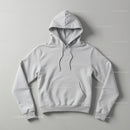 Minimalist White Hoodie Laid Flat on Smooth Surface