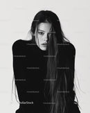 Black and White Portrait of a Woman with Long Hair and Intense Expression