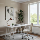 Bright Modern Home Office with Beige Chair and Green Foliage