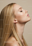 Profile of serene young woman with flawless skin