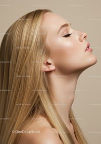Profile of serene young woman with flawless skin