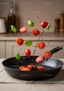 Fresh cherry tomatoes and basil leaves falling in pan