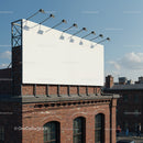 Blank white billboard on brick building rooftop under sky