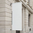 Blank White Banner Hanging on Classic Stone Building