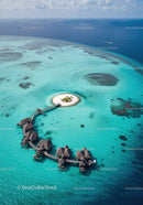 Overwater Bungalows in Turquoise Ocean with Tropical Island View