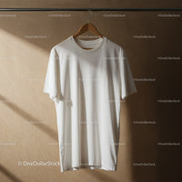 Minimalist White T Shirt Hanging on Wooden Hanger