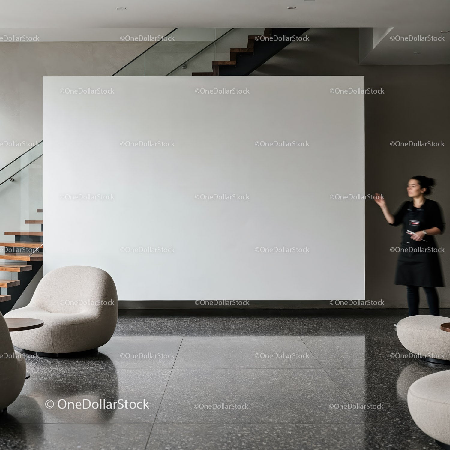 Modern lobby with minimalistic seating and staircase