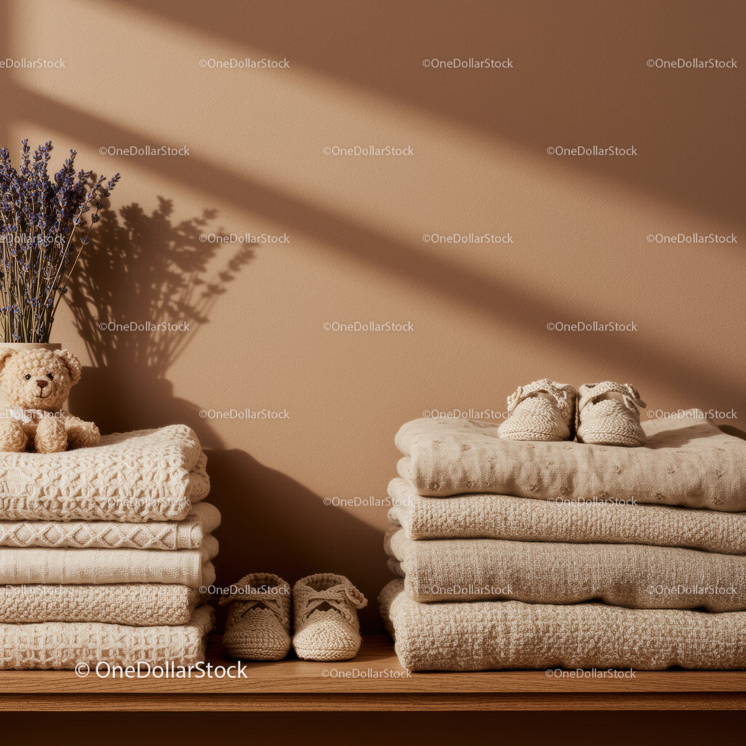 Cozy knitted blankets and baby shoes on wooden shelf