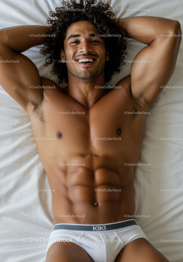 Relaxed young man lying on bed smiling confidently