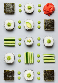 Flat lay of fresh sushi rolls and cucumber slices
