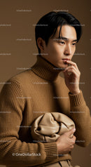 Elegant Male Model in Brown Turtleneck with Beige Handbag Studio Portrait