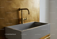 Concrete Bathroom Sink with Gold Faucet and Wall-Mounted Design