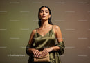 Elegant Woman in Satin Dress with Accessories in Studio Lighting