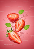 Fresh strawberry halves with splashing water and mint leaves