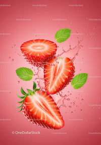 Fresh strawberry halves with splashing water and mint leaves
