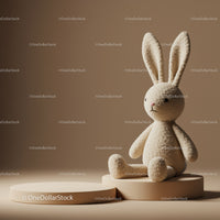 Soft Plush Bunny Sitting on Beige Pedestal