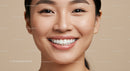 Close-up of happy woman with radiant smile