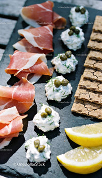 Appetizer platter with prosciutto, cream cheese, and crackers