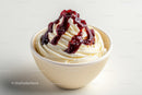 Vanilla Ice Cream with Cherry Sauce in a White Bowl