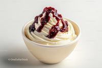 Vanilla Ice Cream with Cherry Sauce in a White Bowl
