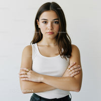 Portrait of a Confident Young Woman in Casual Style with Crossed Arms