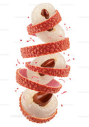 Peeled lychee fruit with visible brown seeds