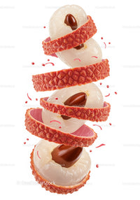 Peeled lychee fruit with visible brown seeds