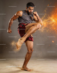 Focused athlete performing dynamic kick in intense training