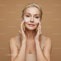 Elegant Mature Woman Applying Skincare Cream for Youthful Skin