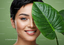 Joyful Woman with a Large Green Leaf and Fresh Water Droplets