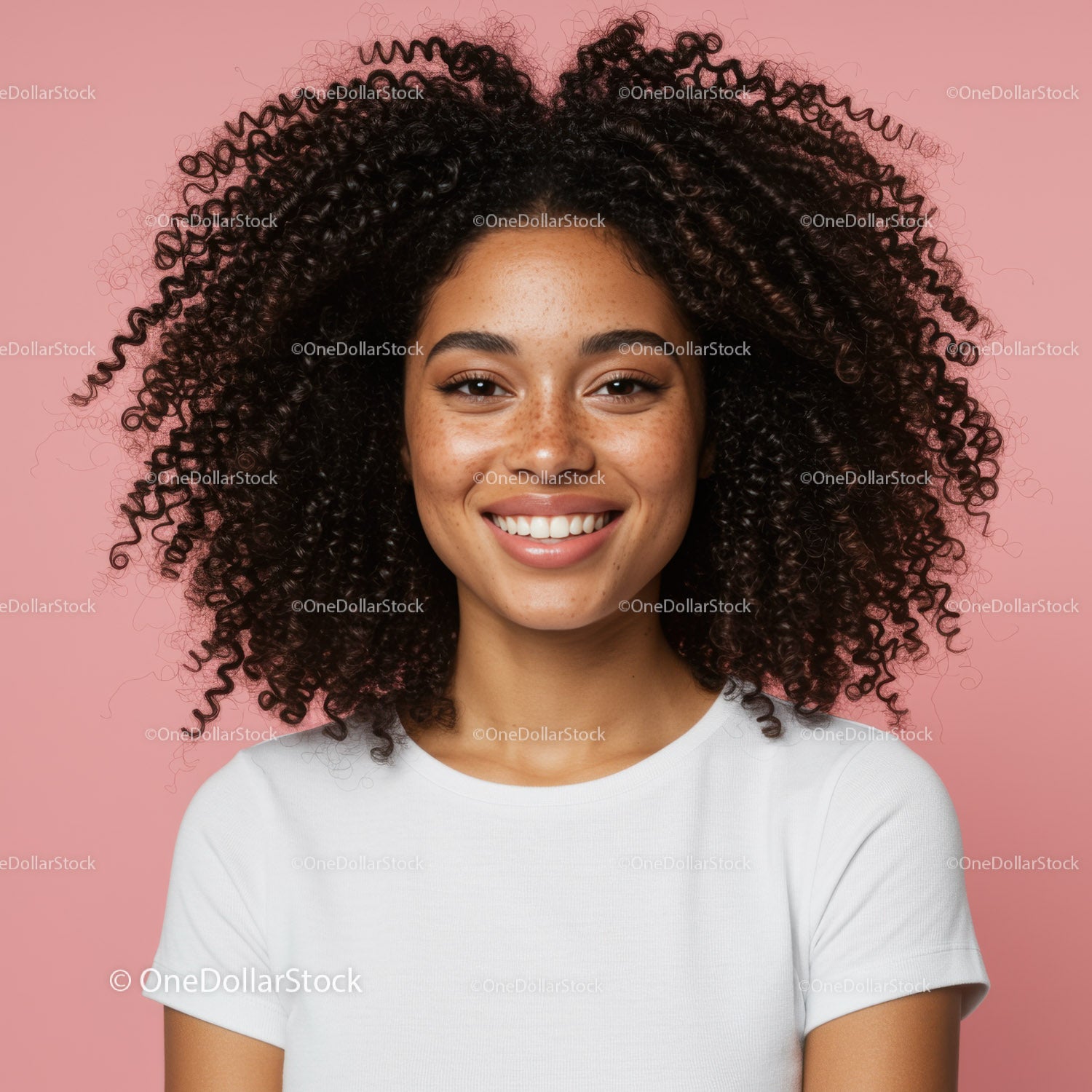 Portrait of a Smiling Woman with Curly Hair Against Pink Background