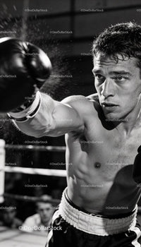 Focused boxer delivering powerful punch in ring