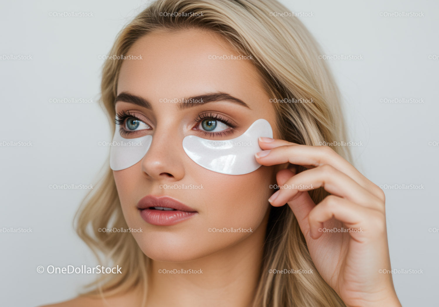 Young Woman Applying Under Eye Patches for Skin Rejuvenation