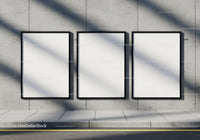 Three Blank Posters on Urban Concrete Wall with Shadows