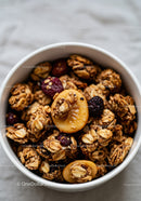 Close-up of granola clusters with dried fruits in bowl