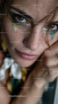 Expressive Woman with Glitter Makeup and Intense Gaze