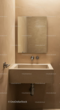 Concrete Sink and Wall-Mounted Faucet in Modern Minimalist Bathroom