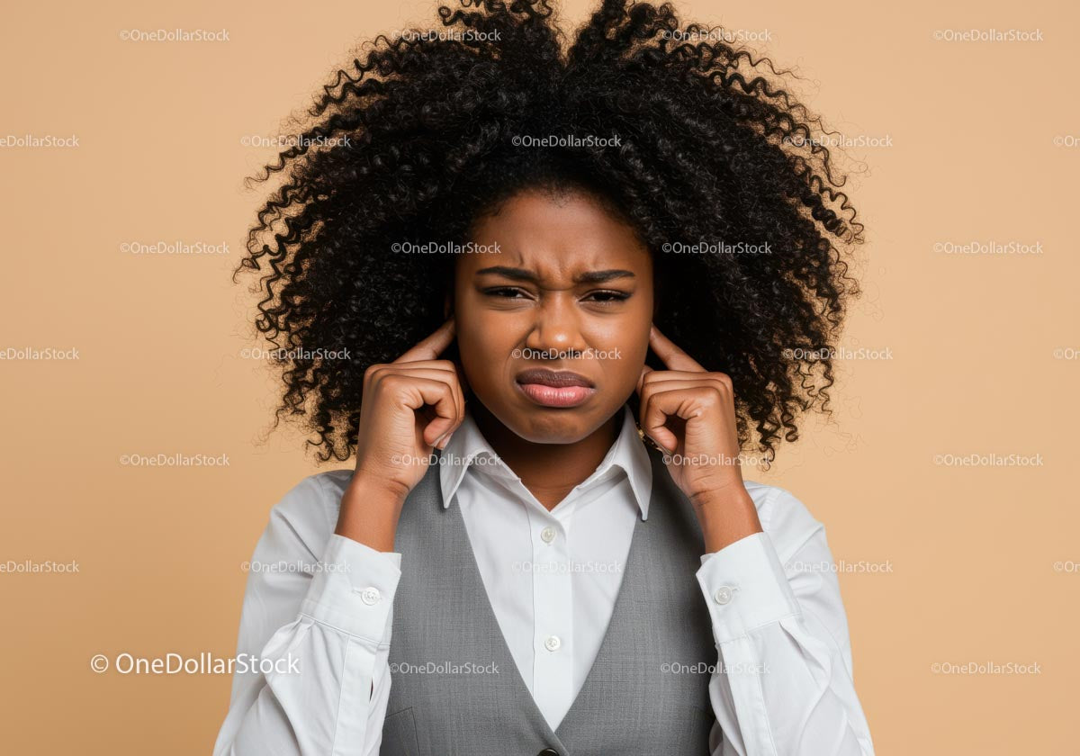 Frustrated Woman Covering Ears with Annoyed Expression