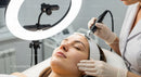 Woman Receiving Advanced Laser Facial Treatment in a Modern Clinic
