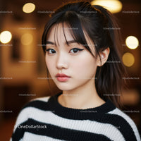 Elegant Young Woman with Stylish Makeup and Trendy Hairstyle