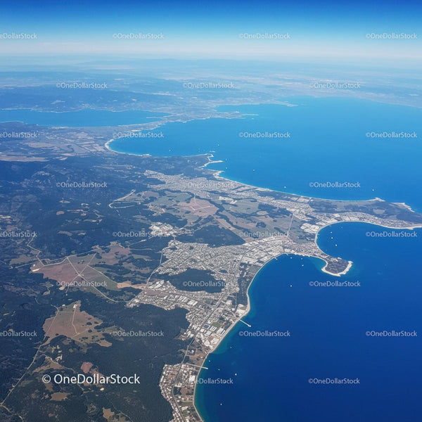 Scenic Aerial View of Coastal Bays and Beaches with Lush Greenery