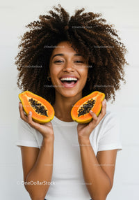 Joyful Woman Holding Halved Papaya with Bright Smile in Studio