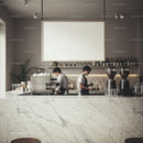 Baristas preparing coffee behind marble counter in cafe