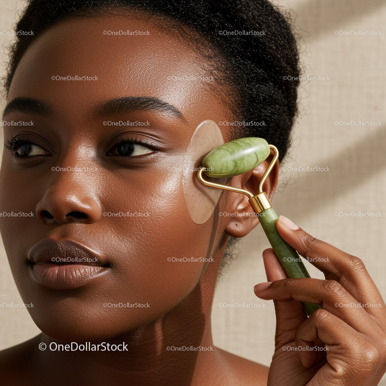 Close Up of a Woman Using a Jade Roller for Facial Massage