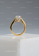 Elegant Gold Engagement Ring with Sparkling Diamond on White Surface