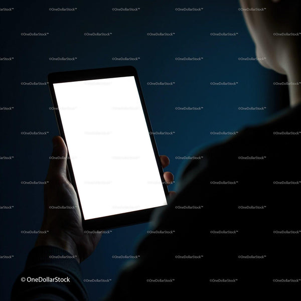 Person holding tablet with bright blank screen at night JPG Mockup Image
