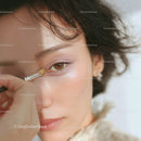 Close-Up of a Woman Applying Eye Shadow with a Makeup Brush
