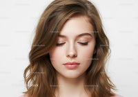 Close Up of Young Woman with Natural Makeup and Soft Expression
